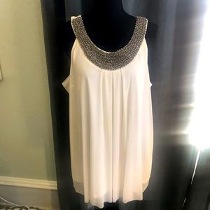 Beautiful jewelry neckline sleeveless blouse